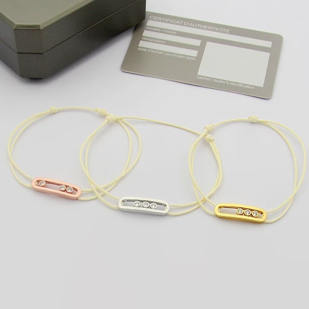 Messika Move Uno bracelet available variants 18K white gold with khaki green cord 18K white gold with black cord 18K rose gold with off-white cord 18K yellow gold with beige cord all set with clear round brilliant diamonds adjustable sliding knot cord fits 15-20cm wrist
