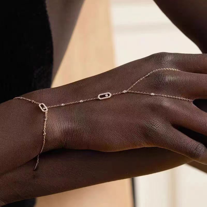 Messika Move Uno bracelet Rose gold metal with clear diamond accents Adjustable chain length