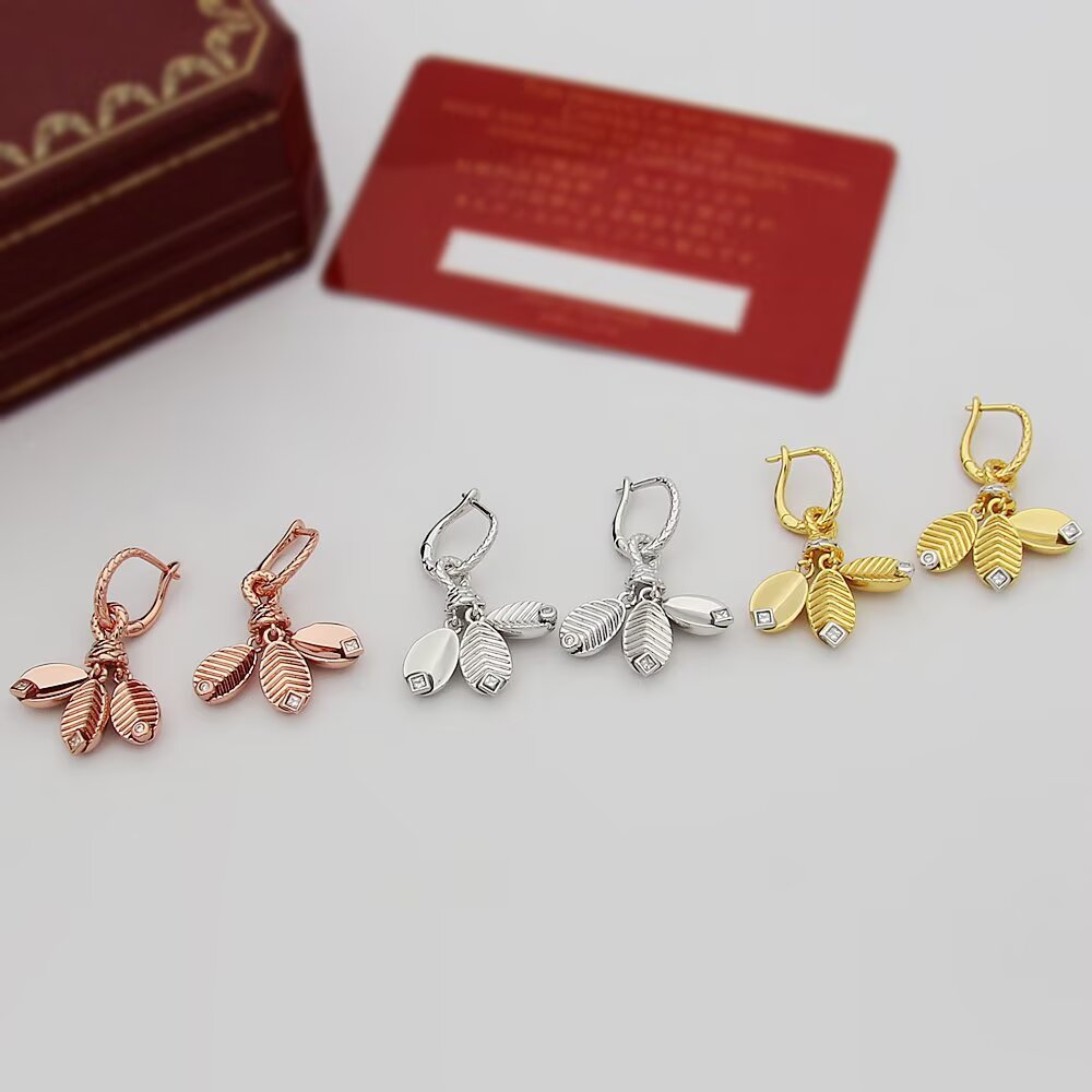 Cartier Grain de Cafe earrings Available in 18k yellow gold with white gold accents and clear diamonds 18k white gold with clear diamonds and 18k rose gold with clear diamonds One Size