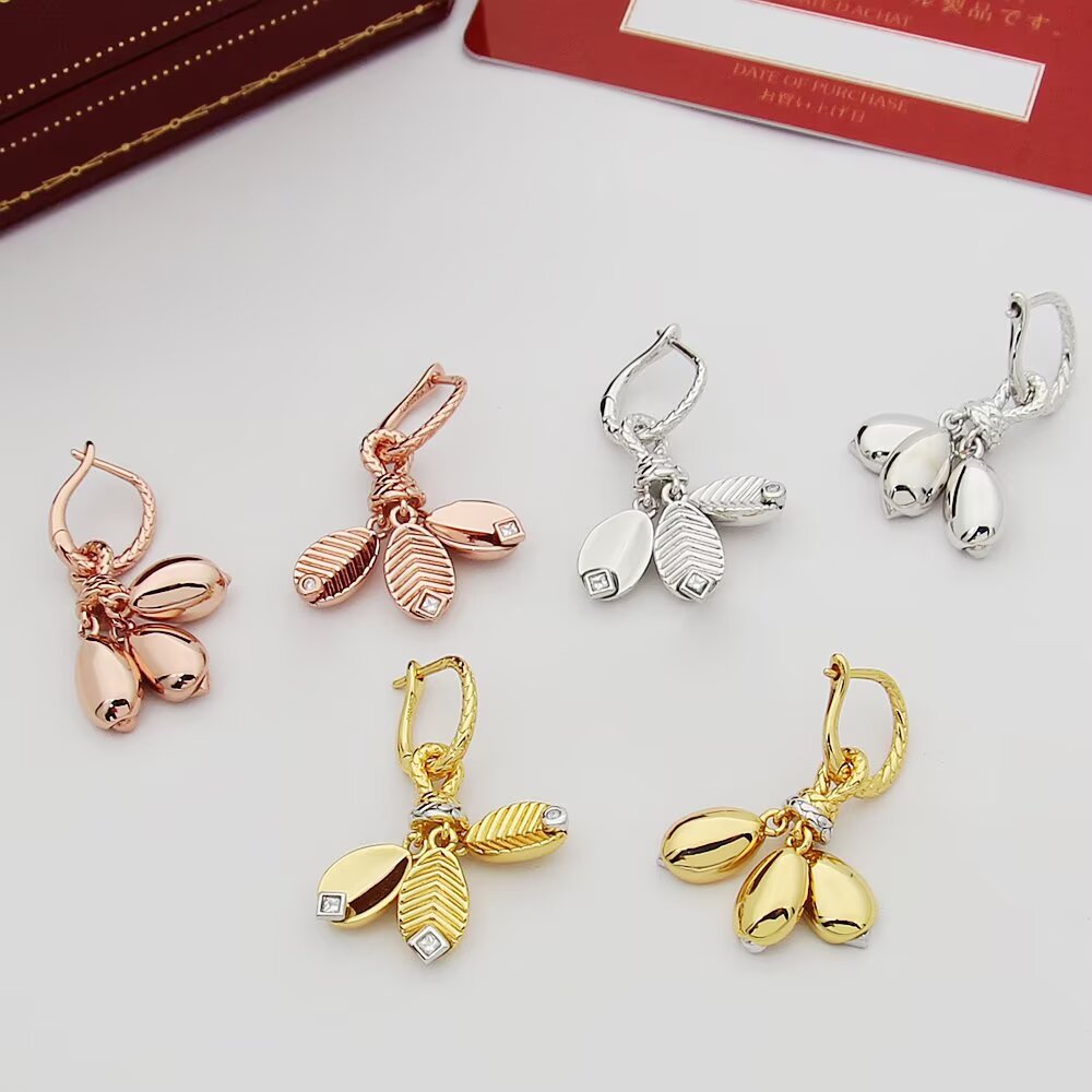 Cartier Grain de Cafe earrings Available in 18k yellow gold with white gold accents and clear diamonds 18k white gold with clear diamonds and 18k rose gold with clear diamonds One Size