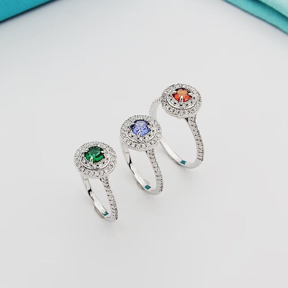Tiffany Tiffany Soleste ring silver-toned white metal with white diamond accents and colored center stones emerald green ruby red tanzanite purple orange garnet 7