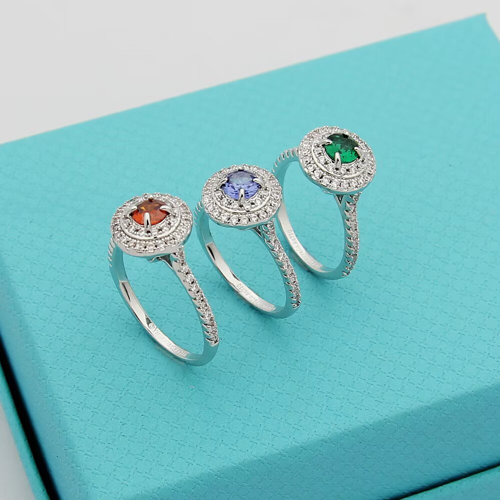 Tiffany Tiffany Soleste ring silver-toned white metal with white diamond accents and colored center stones emerald green ruby red tanzanite purple orange garnet 7
