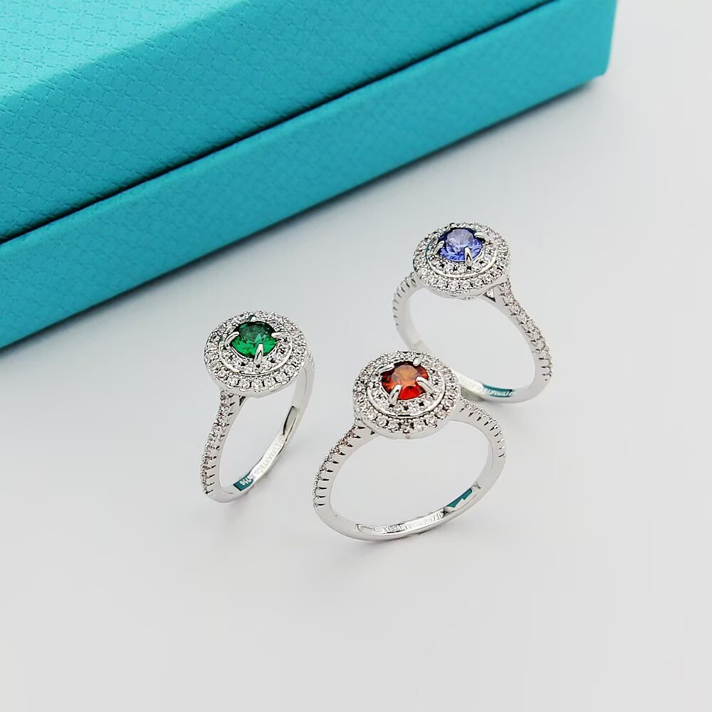 Tiffany Tiffany Soleste ring silver-toned white metal with white diamond accents and colored center stones emerald green ruby red tanzanite purple orange garnet 7