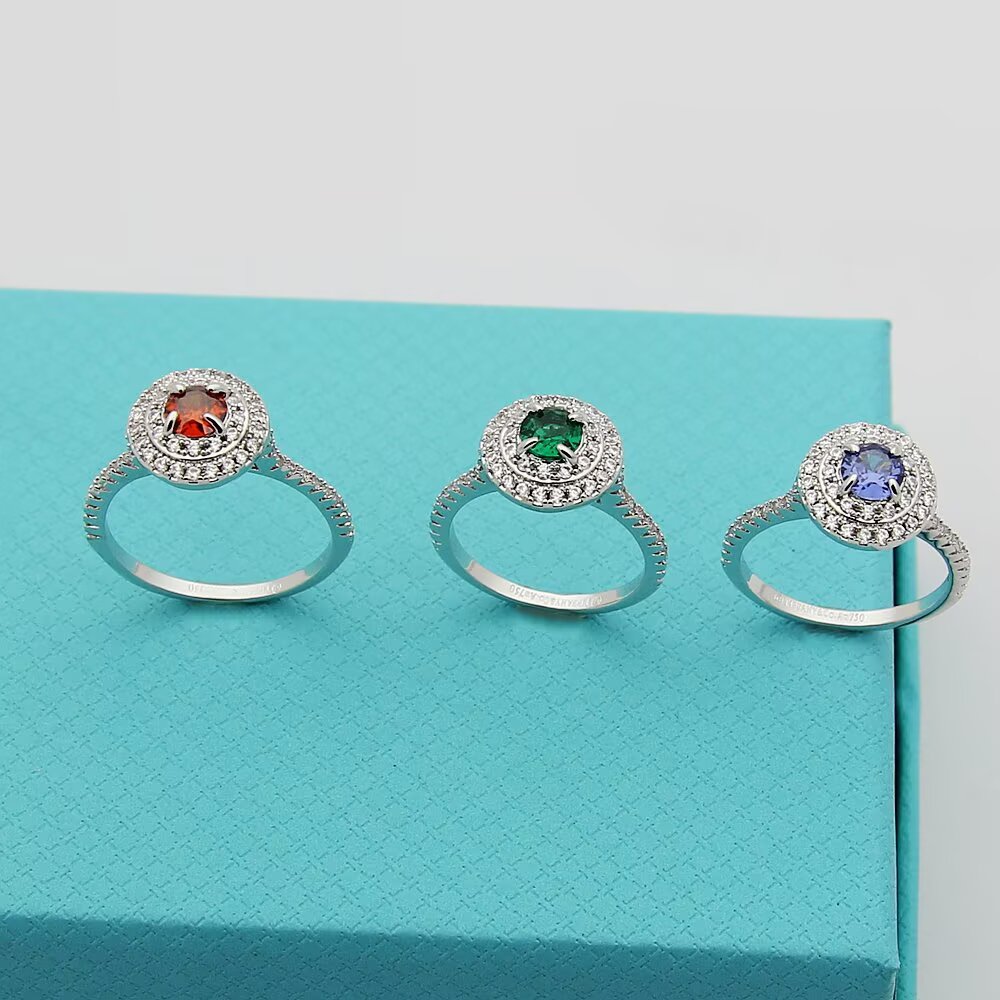 Tiffany Tiffany Soleste ring silver-toned white metal with white diamond accents and colored center stones emerald green ruby red tanzanite purple orange garnet 7