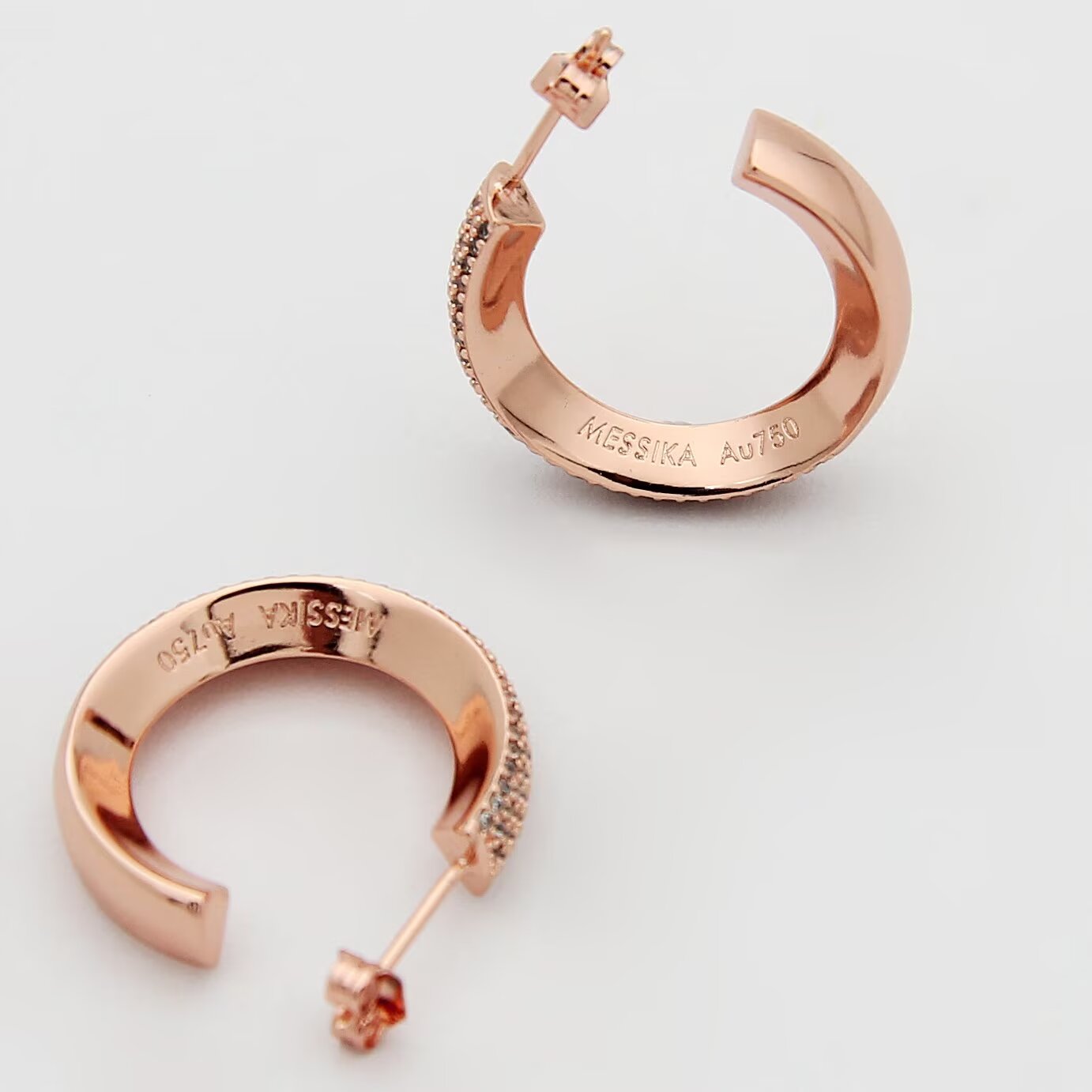 Messika Move Series Pave Hoop Earrings earrings Available in rhodium-plated silver-toned metal yellow gold-toned metal and rose gold-toned metal all set with clear pave diamonds 20mm outer hoop diameter