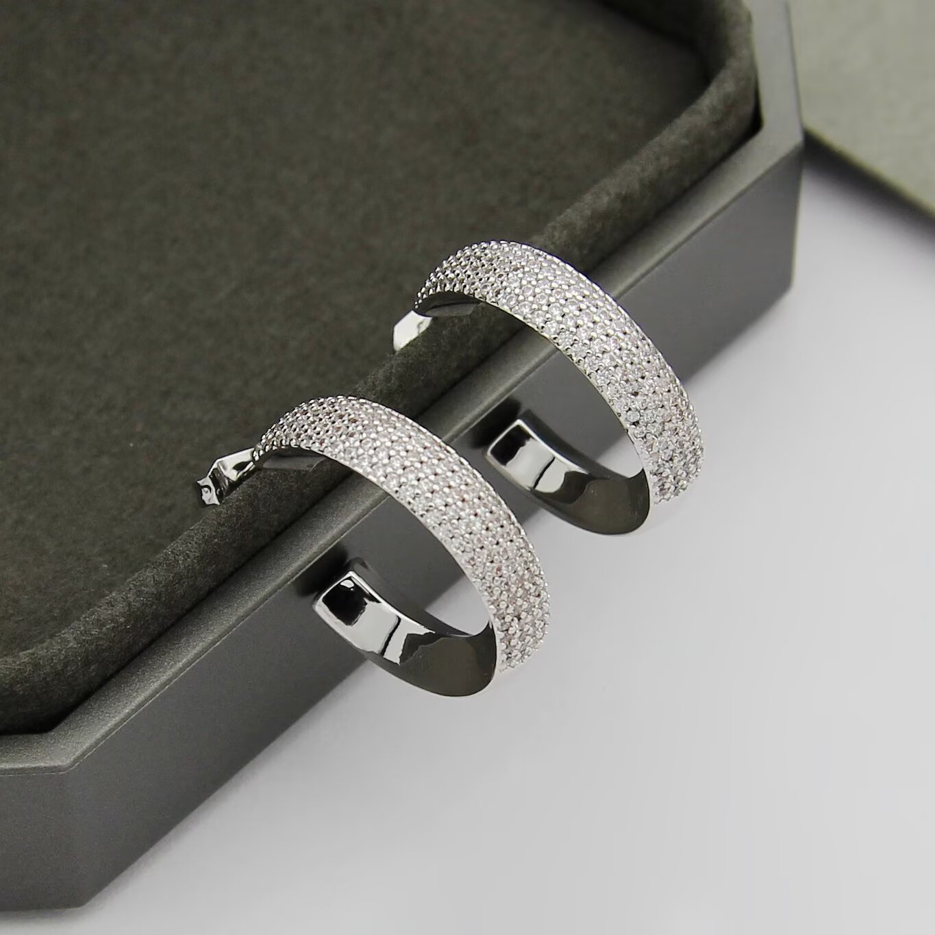 Messika Move Series Pave Hoop Earrings earrings Available in rhodium-plated silver-toned metal yellow gold-toned metal and rose gold-toned metal all set with clear pave diamonds 20mm outer hoop diameter