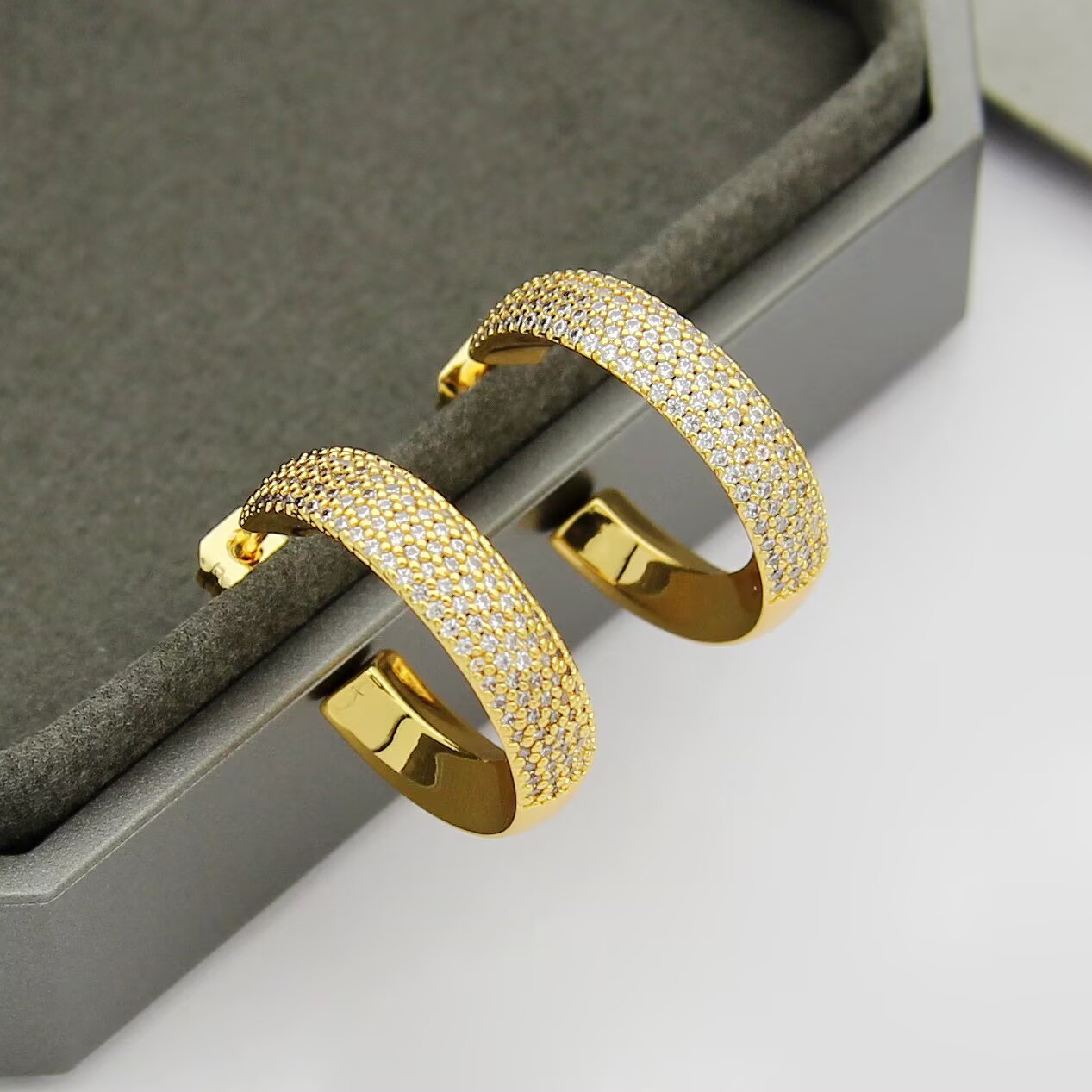 Messika Move Series Pave Hoop Earrings earrings Available in rhodium-plated silver-toned metal yellow gold-toned metal and rose gold-toned metal all set with clear pave diamonds 20mm outer hoop diameter