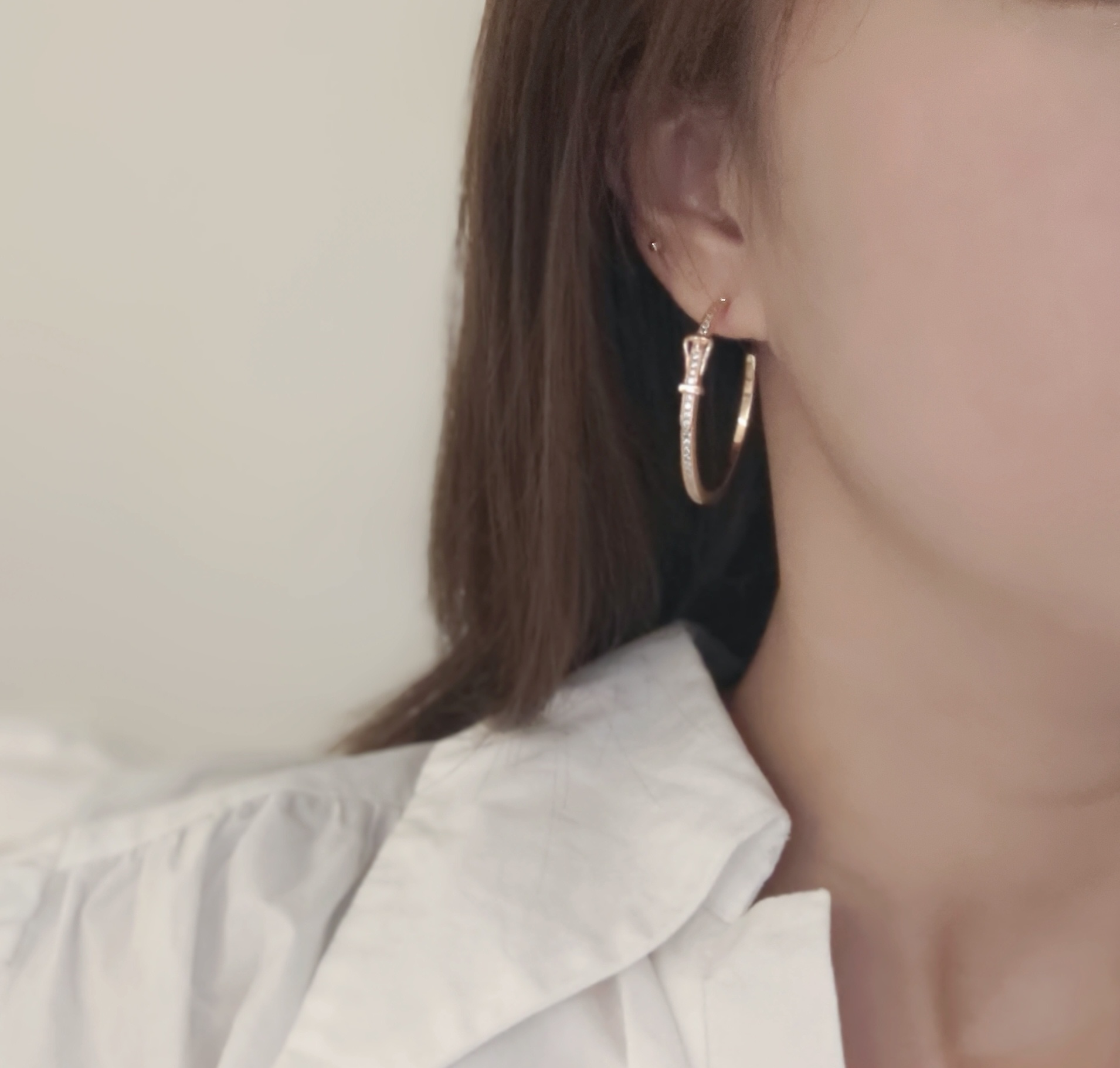 Hermes Buckle Hoop earrings Available in rose gold silver yellow gold metal tones with clear diamond-like accent stones 30mm diameter