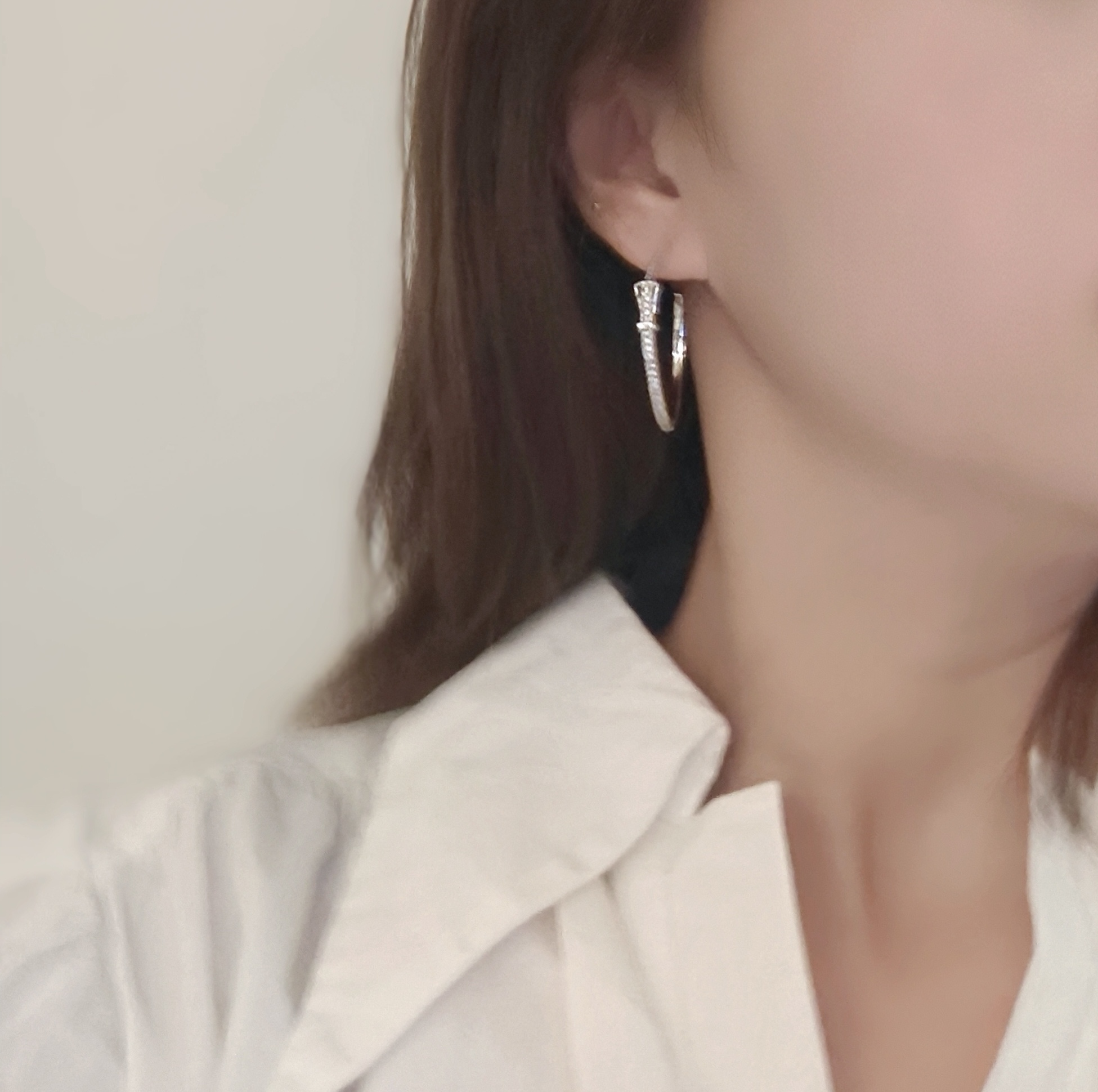 Hermes Buckle Hoop earrings Available in rose gold silver yellow gold metal tones with clear diamond-like accent stones 30mm diameter