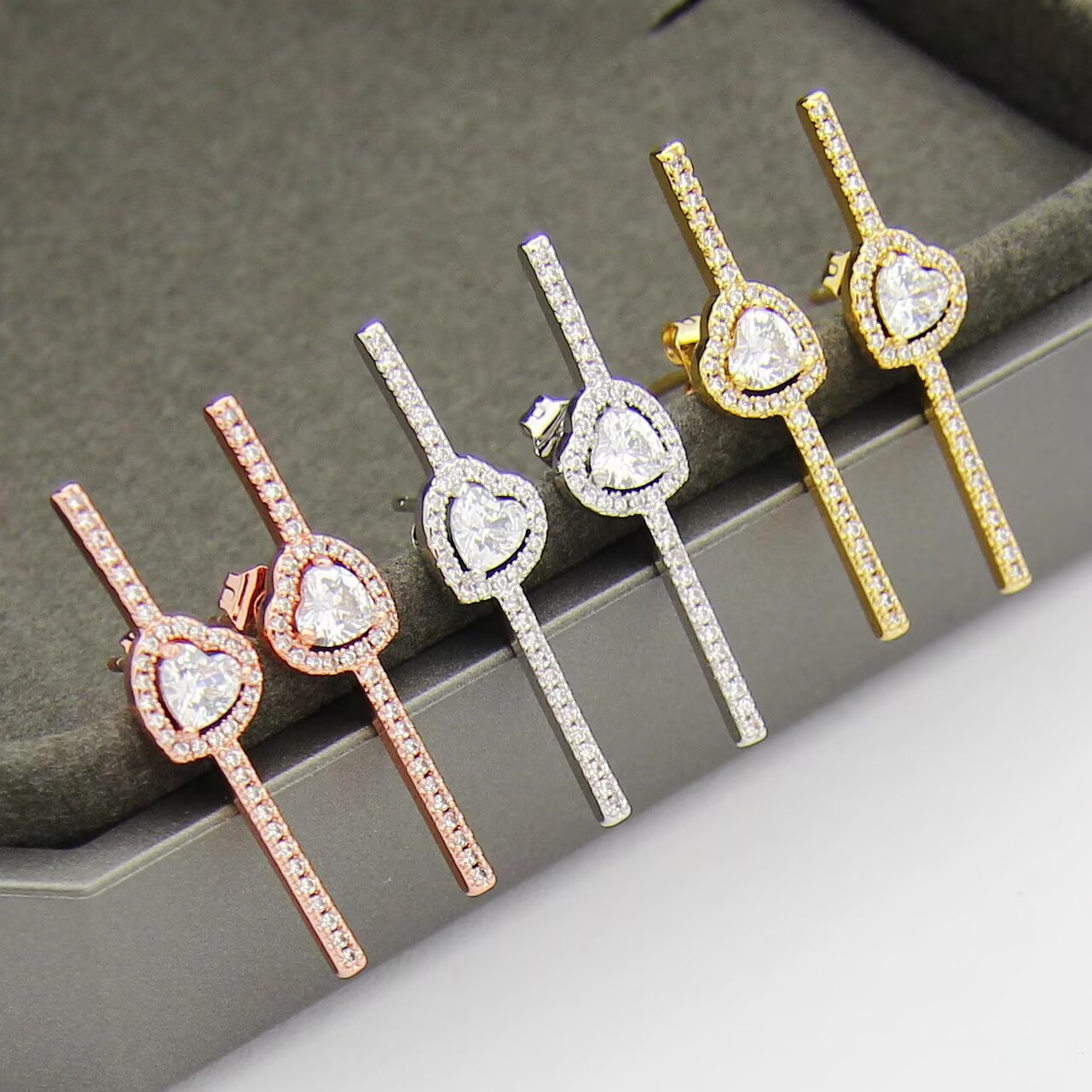 Messika Joy C ur earrings 18K white gold 18K rose gold 18K yellow gold with clear diamonds single earring 0 15 carat heart-shaped center diamond