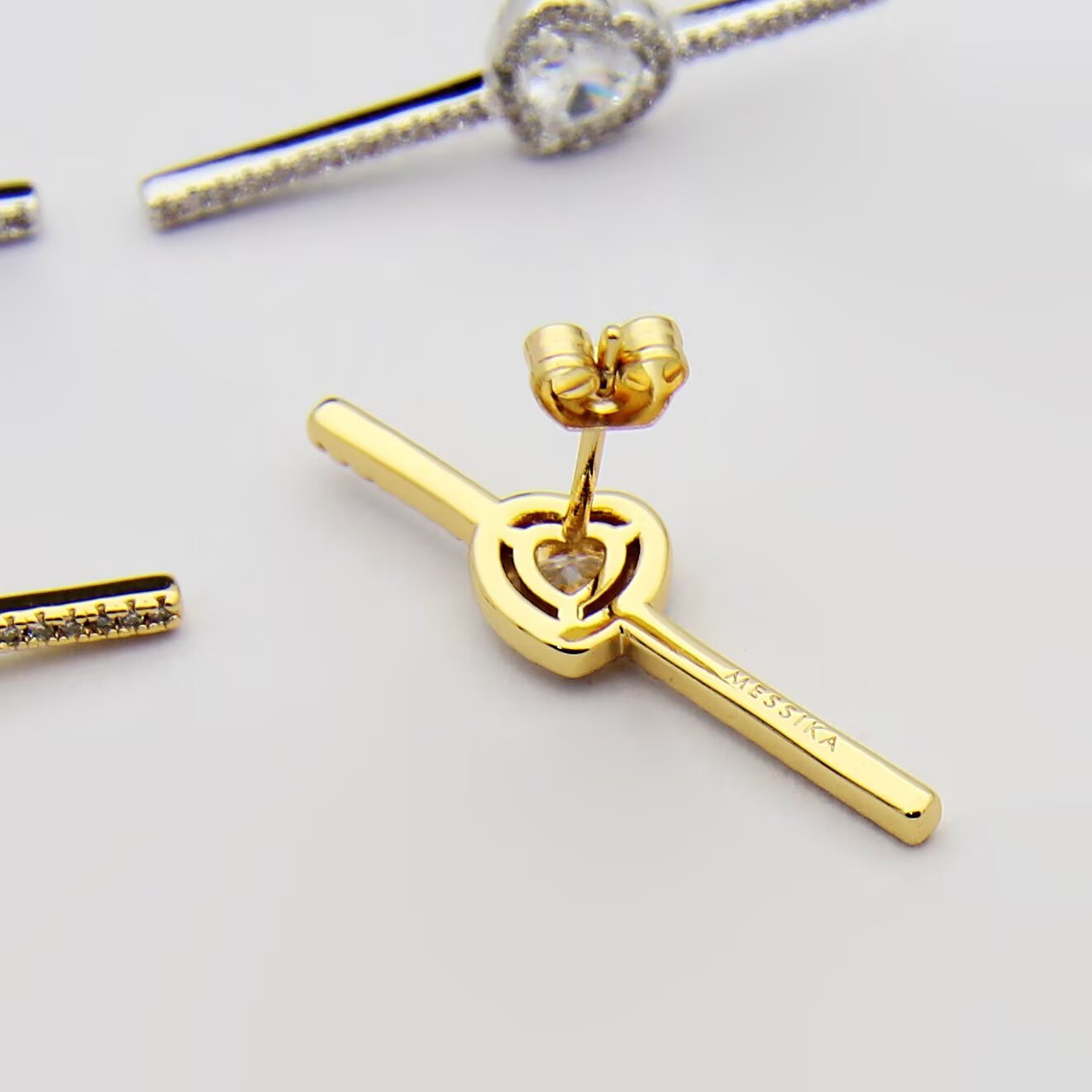 Messika Joy C ur earrings 18K white gold 18K rose gold 18K yellow gold with clear diamonds single earring 0 15 carat heart-shaped center diamond