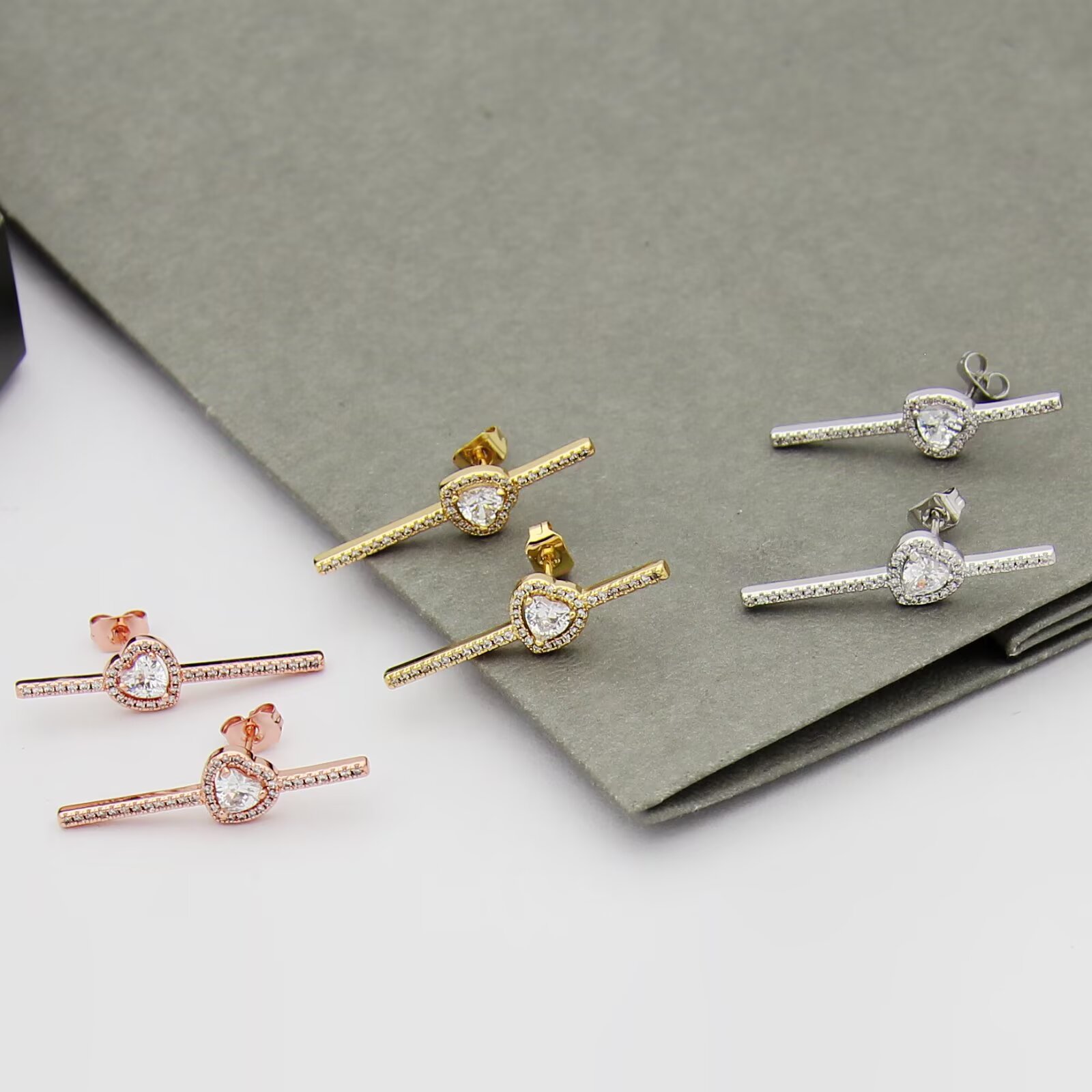 Messika Joy C ur earrings 18K white gold 18K rose gold 18K yellow gold with clear diamonds single earring 0 15 carat heart-shaped center diamond