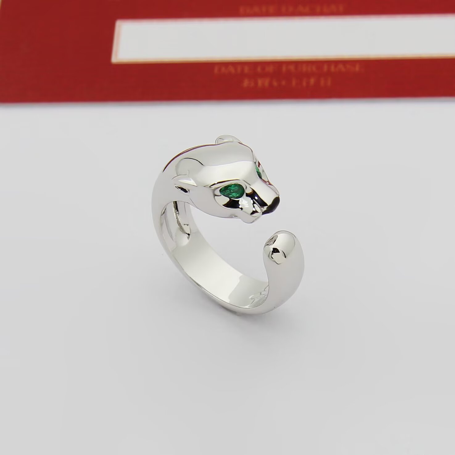 Cartier Panthere de Cartier ring 18k rose gold 18k white gold 18k yellow gold with green tsavorite garnet eyes and black onyx nose accents adjustable open band