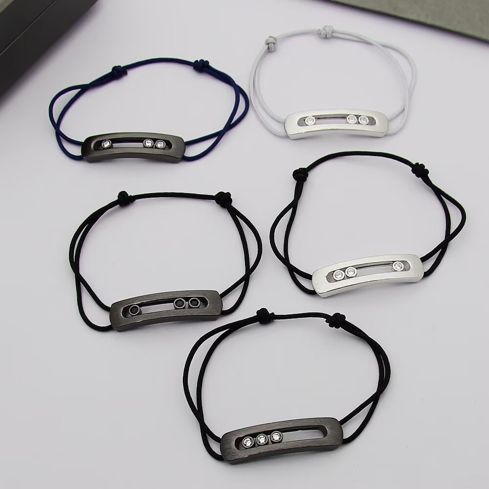 Messika Move Titanium Romain Grosjean Men s Collection bracelet brushed titanium gray metal clear white diamonds gray black navy blue cord options adjustable sliding knot