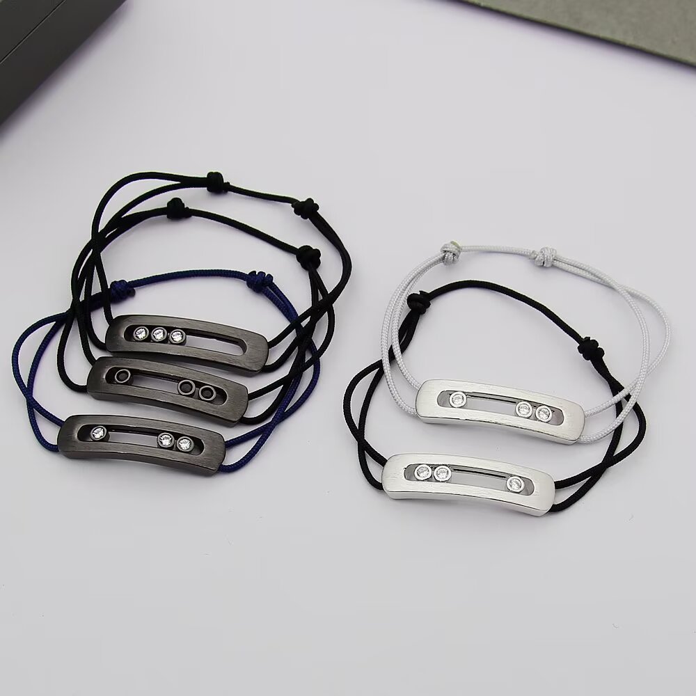 Messika Move Titanium Romain Grosjean Men s Collection bracelet brushed titanium gray metal clear white diamonds gray black navy blue cord options adjustable sliding knot