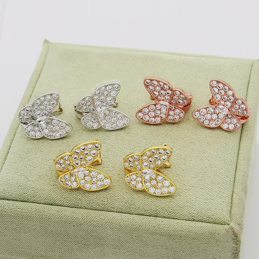 Van Cleef Arpels Two Butterfly earrings 18K yellow gold with clear diamonds 18K white gold with clear diamonds 18K rose gold with clear diamonds One Size
