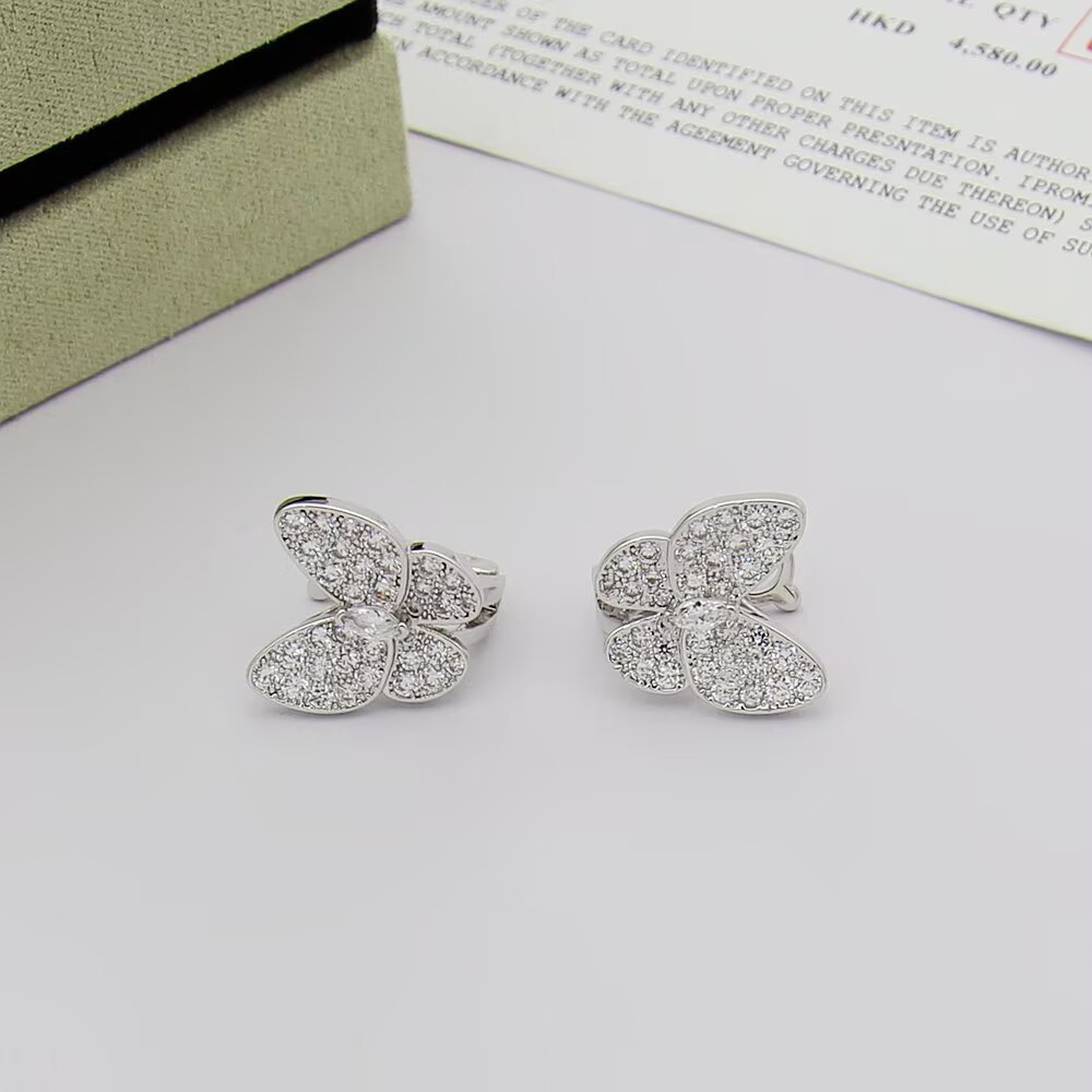 Van Cleef Arpels Two Butterfly earrings 18K yellow gold with clear diamonds 18K white gold with clear diamonds 18K rose gold with clear diamonds One Size