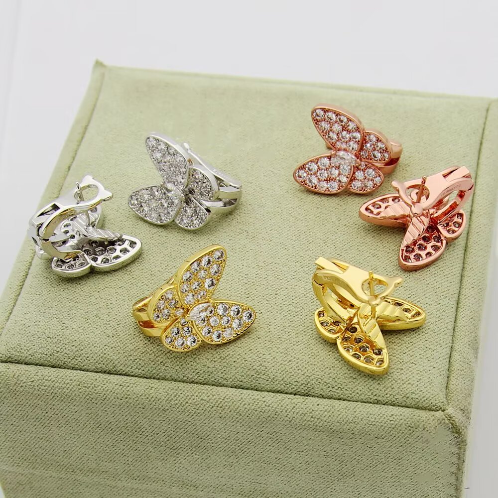 Van Cleef Arpels Two Butterfly earrings 18K yellow gold with clear diamonds 18K white gold with clear diamonds 18K rose gold with clear diamonds One Size