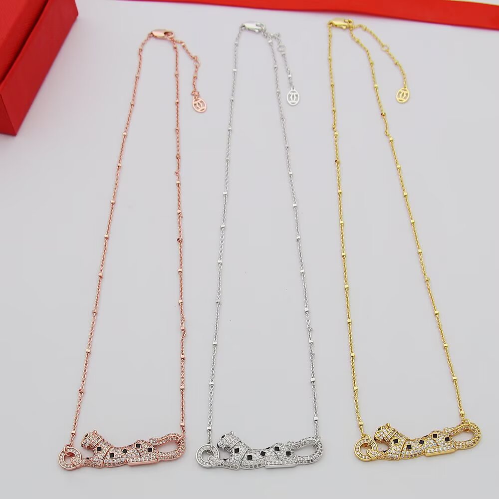 Cartier Panthere de Cartier necklace 18k yellow gold paved clear diamonds black onyx spots tsavorite garnet eyes 42cm