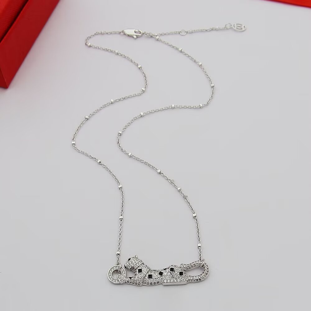 Cartier Panthere de Cartier necklace 18k yellow gold paved clear diamonds black onyx spots tsavorite garnet eyes 42cm