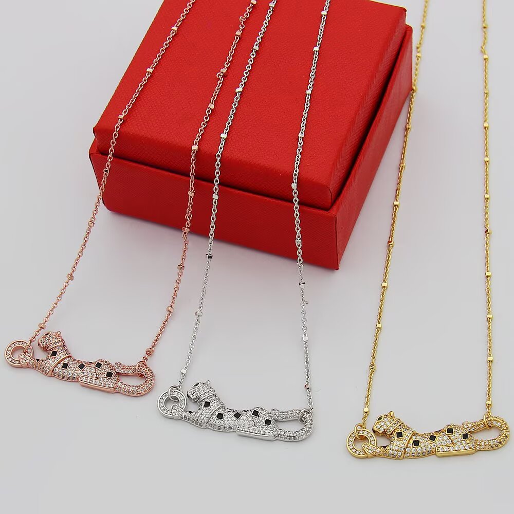 Cartier Panthere de Cartier necklace 18k yellow gold paved clear diamonds black onyx spots tsavorite garnet eyes 42cm