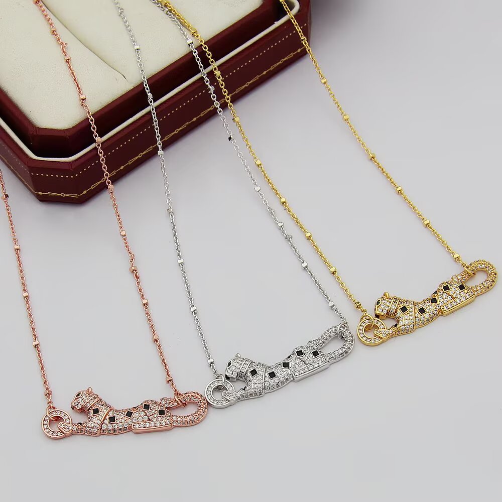 Cartier Panthere de Cartier necklace 18k yellow gold paved clear diamonds black onyx spots tsavorite garnet eyes 42cm