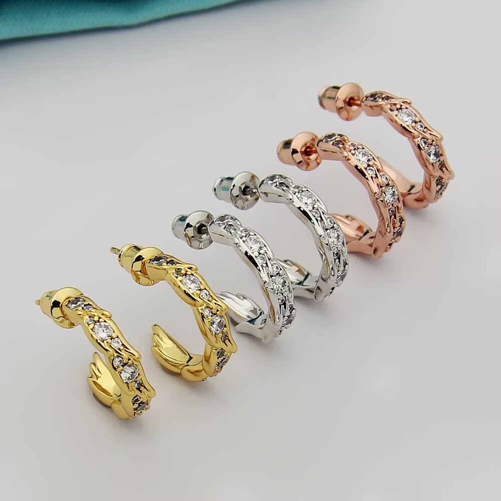 Tiffany Tiffany Victoria Vine Hoop Earrings earrings Available in 18k yellow gold 18k rose gold and sterling silver with round brilliant diamond accents 15mm hoop diameter