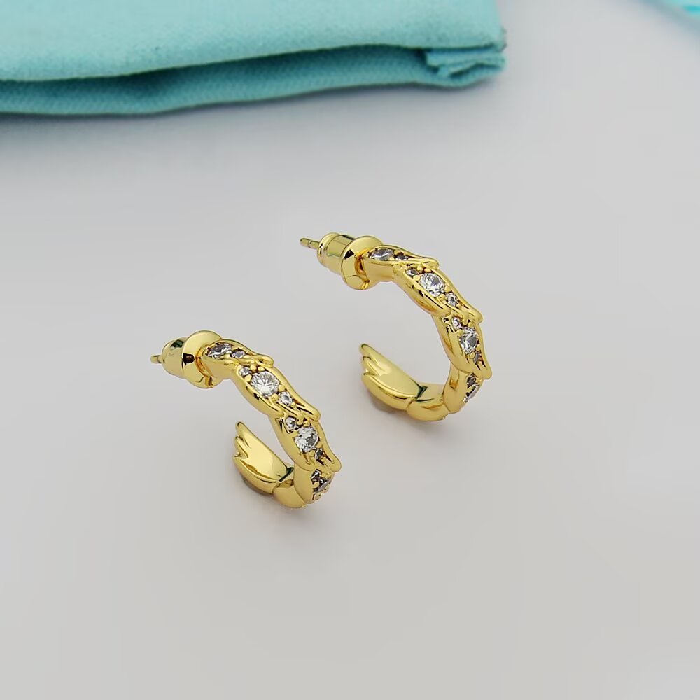 Tiffany Tiffany Victoria Vine Hoop Earrings earrings Available in 18k yellow gold 18k rose gold and sterling silver with round brilliant diamond accents 15mm hoop diameter