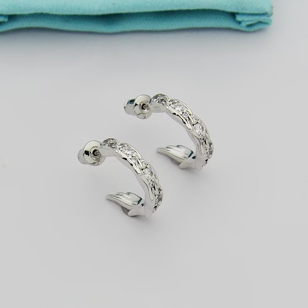 Tiffany Tiffany Victoria Vine Hoop Earrings earrings Available in 18k yellow gold 18k rose gold and sterling silver with round brilliant diamond accents 15mm hoop diameter