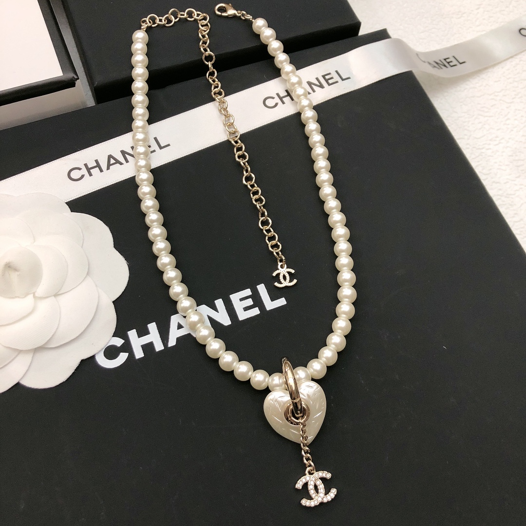 Chanel CC Heart Pearl Pendant Necklace necklace Gold-tone metal white faux pearl clear crystal white mother-of-pearl effect heart charm 40cm with 7cm extender chain