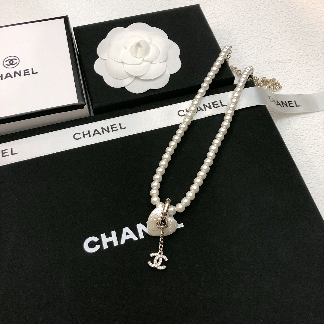 Chanel CC Heart Pearl Pendant Necklace necklace Gold-tone metal white faux pearl clear crystal white mother-of-pearl effect heart charm 40cm with 7cm extender chain