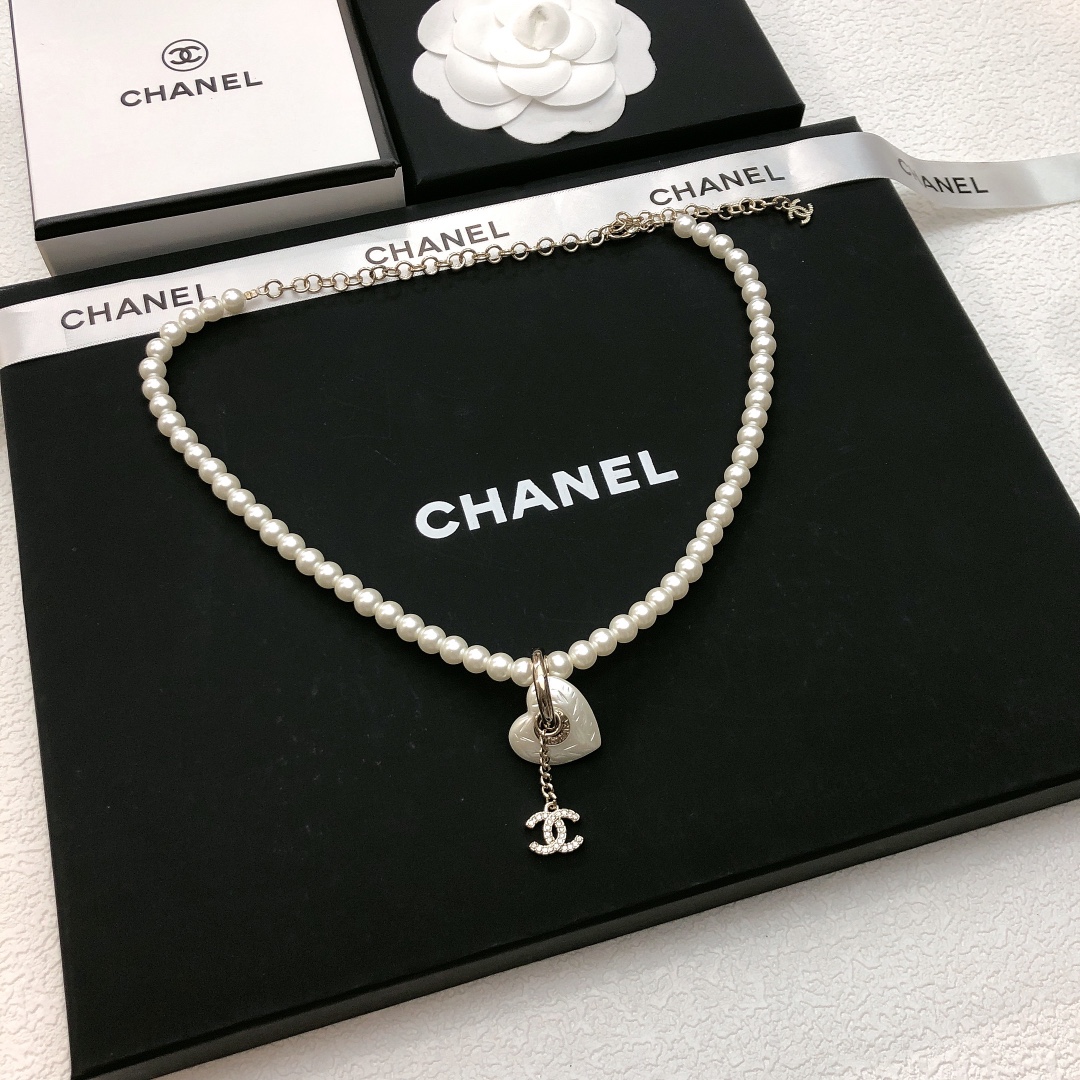 Chanel CC Heart Pearl Pendant Necklace necklace Gold-tone metal white faux pearl clear crystal white mother-of-pearl effect heart charm 40cm with 7cm extender chain