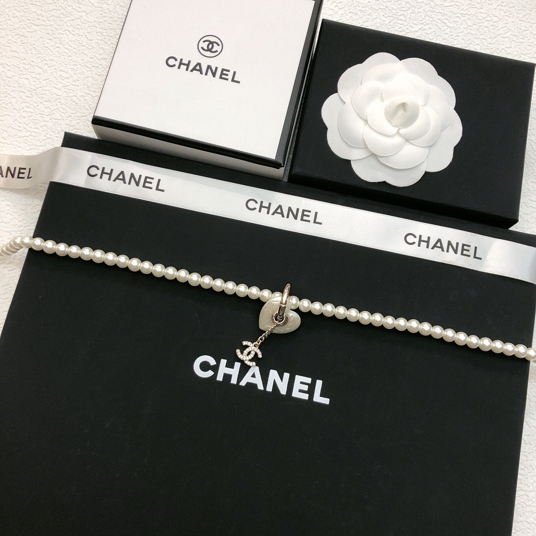 Chanel CC Heart Pearl Pendant Necklace necklace Gold-tone metal white faux pearl clear crystal white mother-of-pearl effect heart charm 40cm with 7cm extender chain