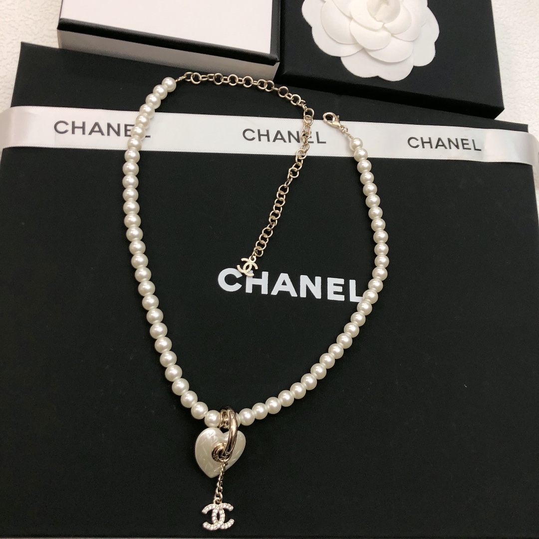 Chanel CC Heart Pearl Pendant Necklace necklace Gold-tone metal white faux pearl clear crystal white mother-of-pearl effect heart charm 40cm with 7cm extender chain