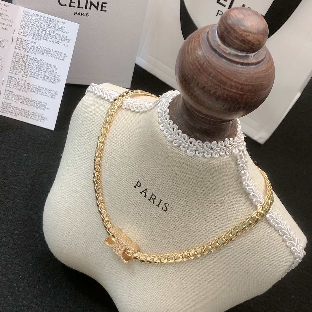 Celine Triomphe necklace gold-tone metal with clear crystal accents silver-tone metal with clear crystal accents 40cm with 5cm extender