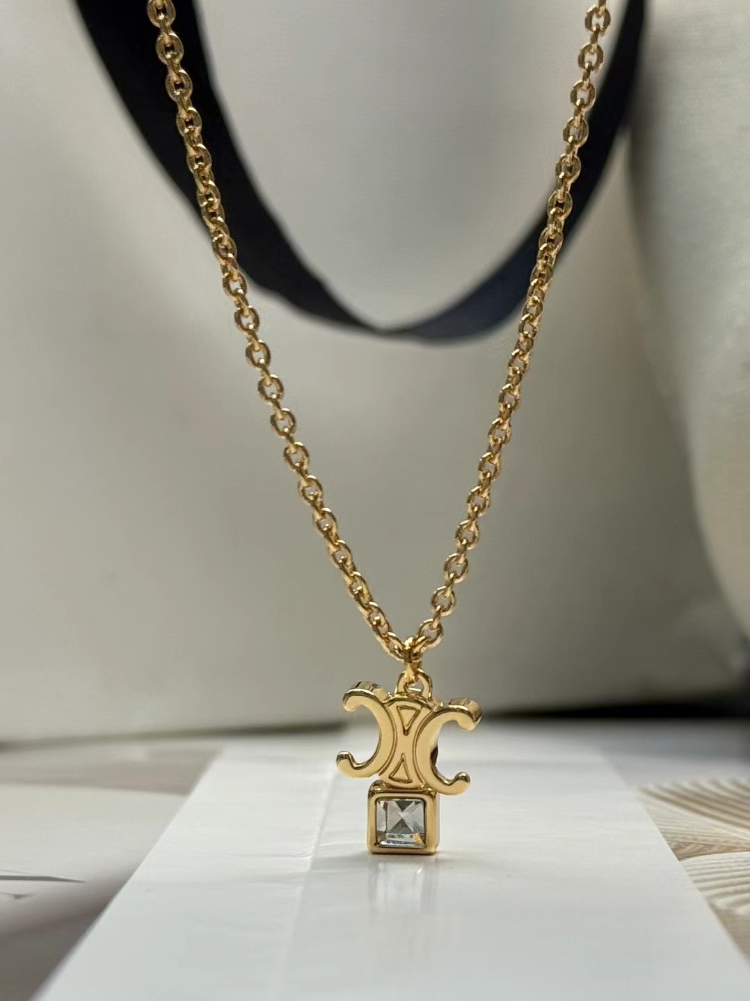 Celine Triomphe Crystal Pendant necklace gold-tone metal with clear faceted crystal 42cm with 5cm extender