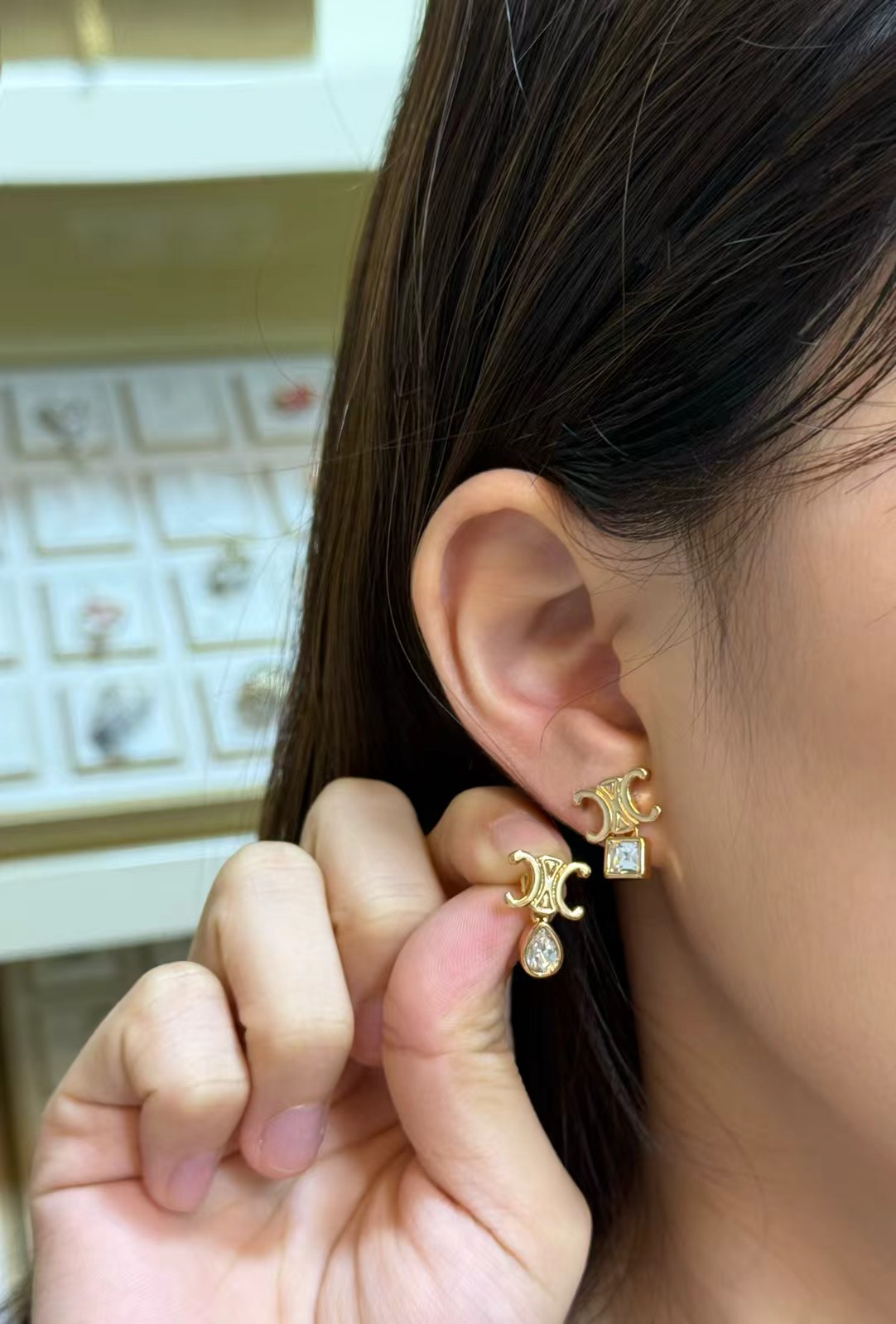 Celine Triomphe Asymmetric Crystal Stud Earrings earrings Gold-tone metal with clear faceted crystals one pear-cut one princess-cut One Size post stud approx 1 2cm drop length