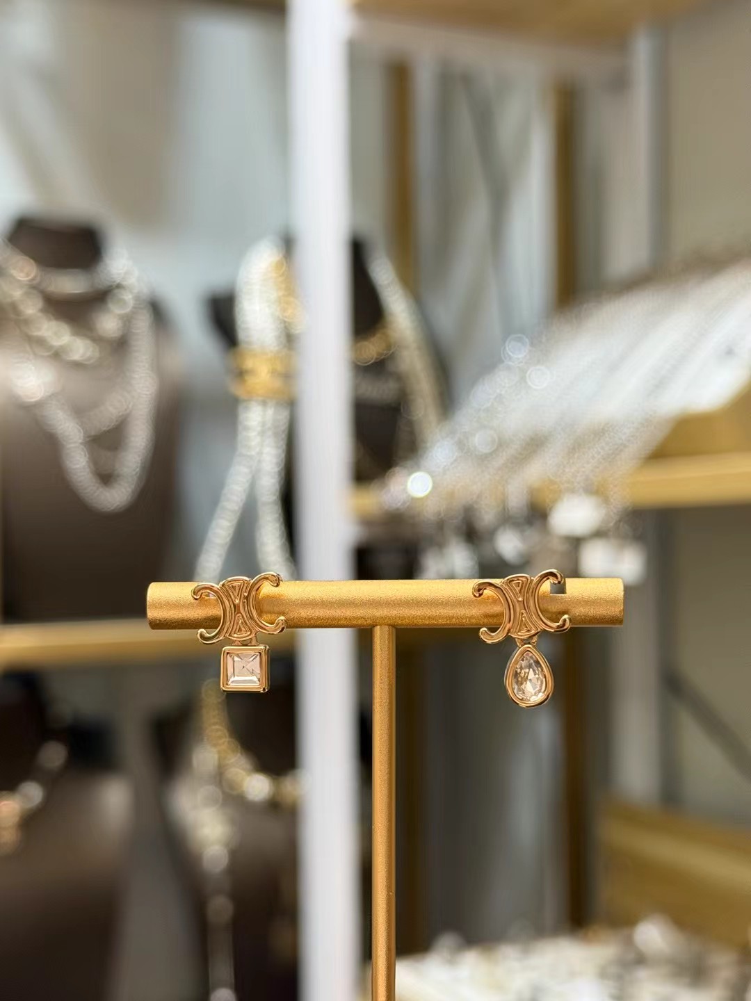 Celine Triomphe Asymmetric Crystal Stud Earrings earrings Gold-tone metal with clear faceted crystals one pear-cut one princess-cut One Size post stud approx 1 2cm drop length
