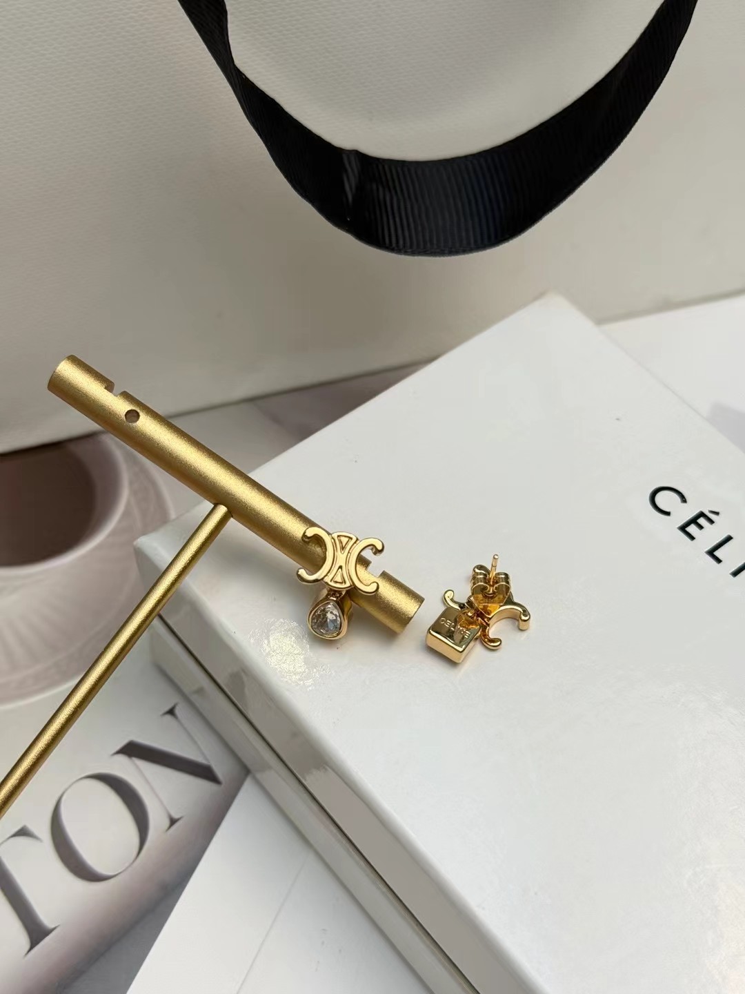 Celine Triomphe Asymmetric Crystal Stud Earrings earrings Gold-tone metal with clear faceted crystals one pear-cut one princess-cut One Size post stud approx 1 2cm drop length