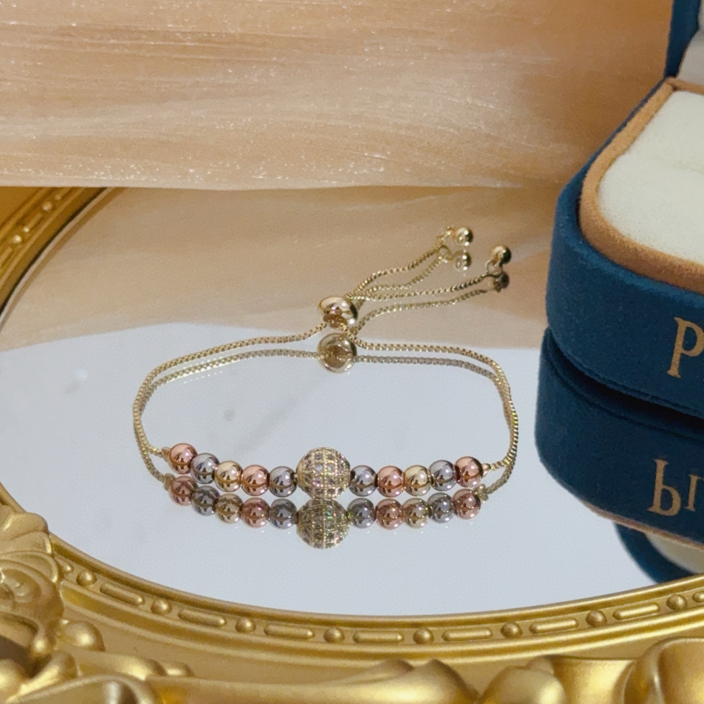 Piaget Possession bracelet tri-tone yellow gold rose gold white gold metal with clear diamond pave accent bead adjustable sliding chain maximum length 22cm