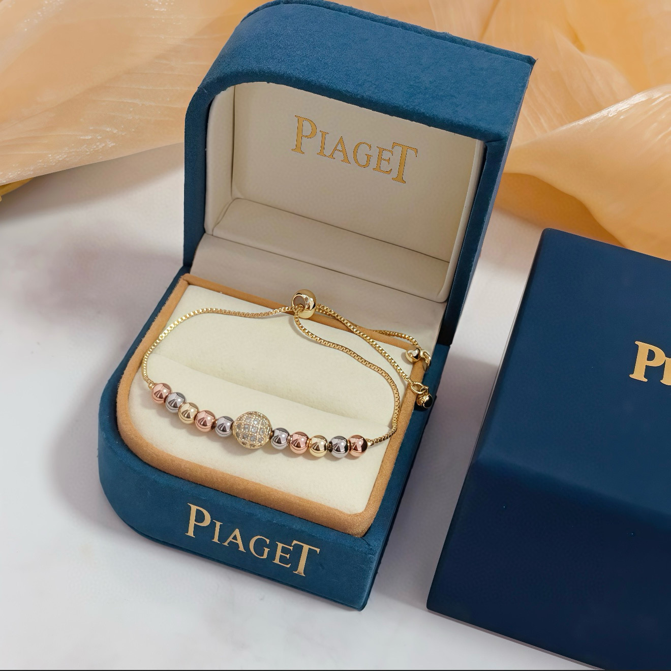 Piaget Possession bracelet tri-tone yellow gold rose gold white gold metal with clear diamond pave accent bead adjustable sliding chain maximum length 22cm