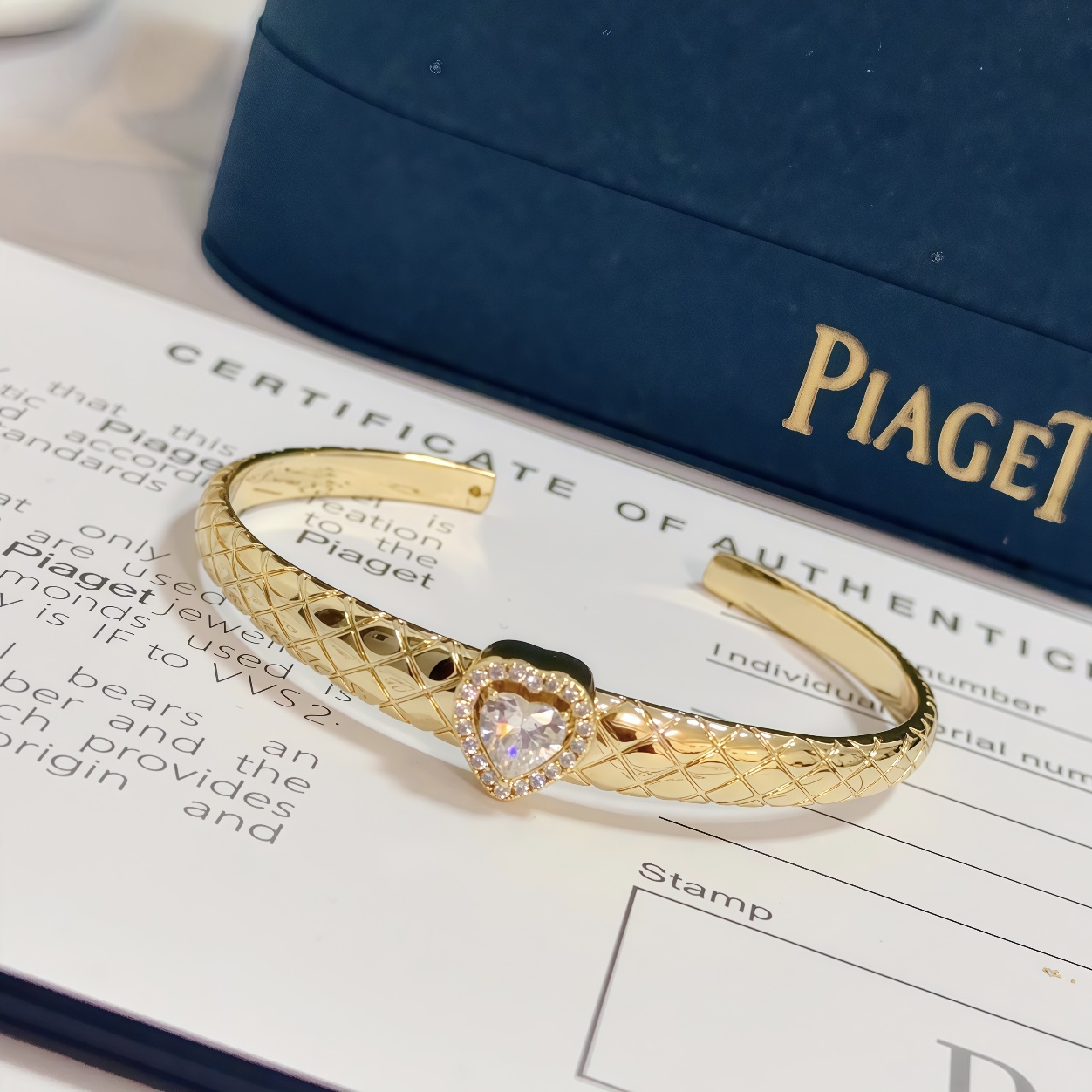 Piaget Heart Diamond Quilted Open Bangle bracelet 18k yellow gold with clear heart-cut diamond and diamond halo 17cm inner circumference