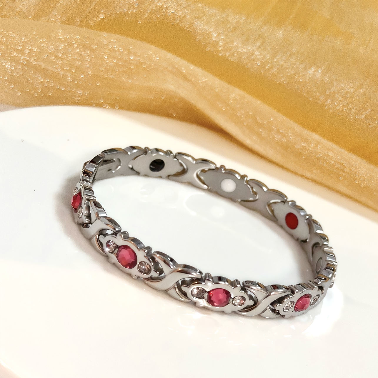 Piaget Magnetic Therapy Link Bracelet bracelet Silver-toned metal with pink gemstones clear accent stones and black white red magnetic inlays 19cm