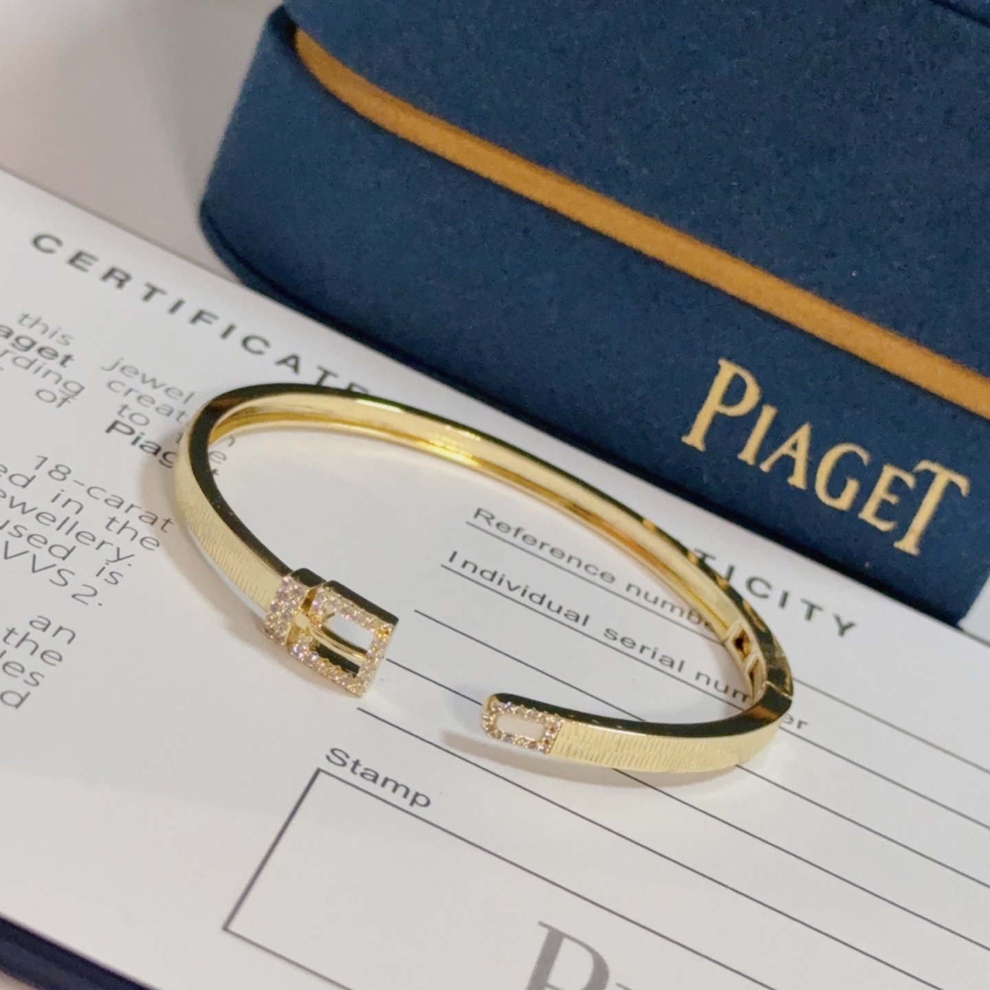 Piaget Possession Buckle Cuff bracelet 18k yellow gold with clear diamond accents and white mother-of-pearl inlay 17cm inner circumference
