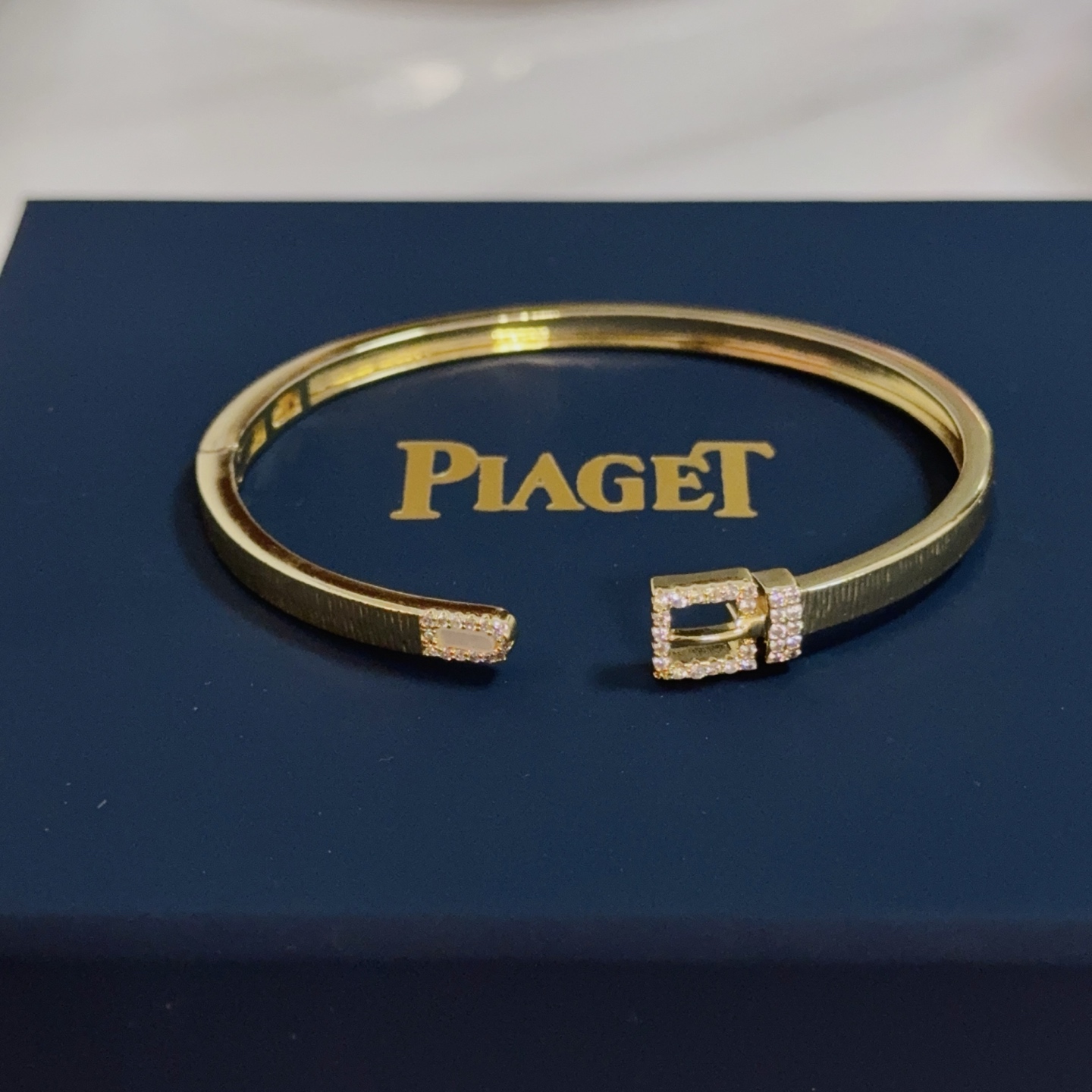 Piaget Possession Buckle Cuff bracelet 18k yellow gold with clear diamond accents and white mother-of-pearl inlay 17cm inner circumference