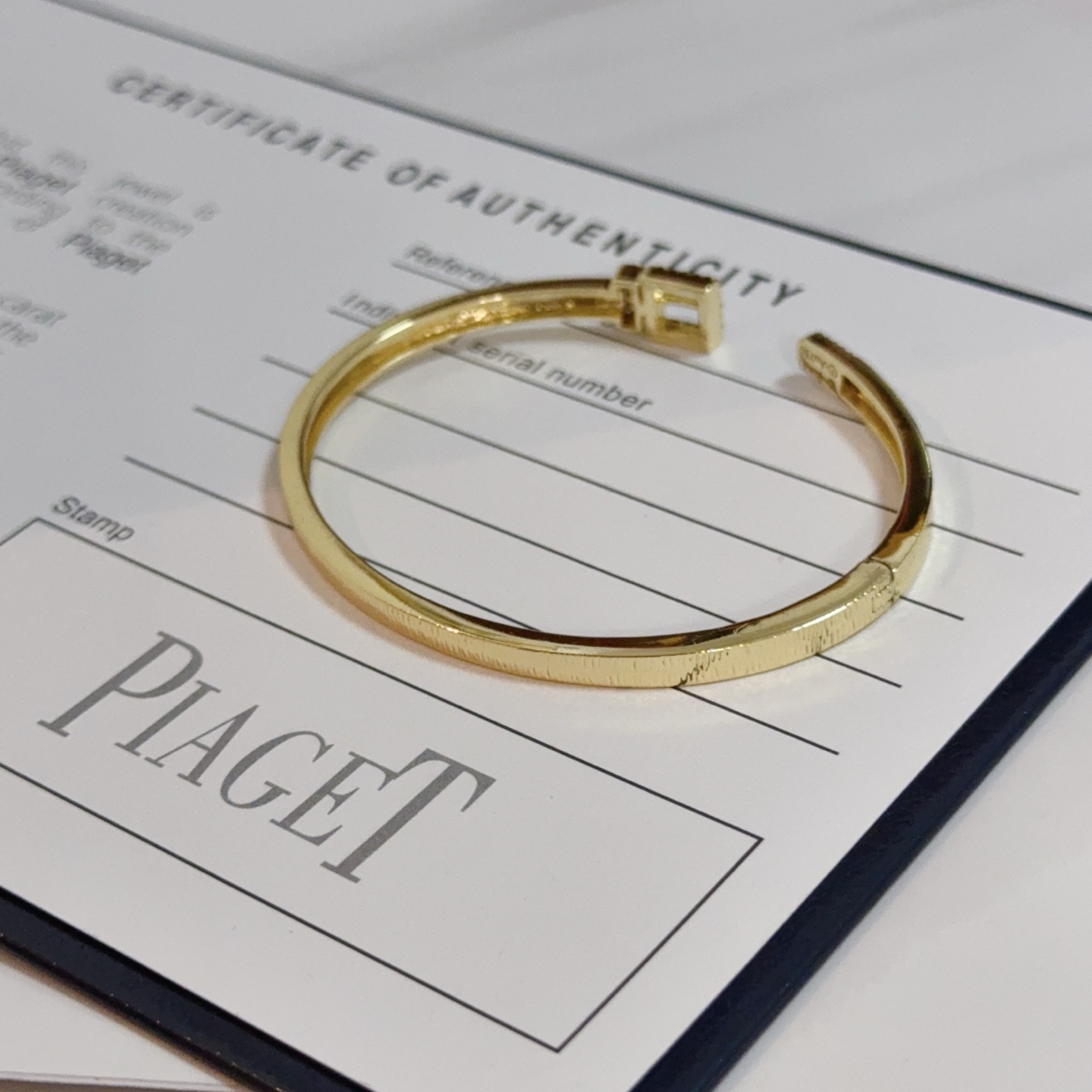 Piaget Possession Buckle Cuff bracelet 18k yellow gold with clear diamond accents and white mother-of-pearl inlay 17cm inner circumference