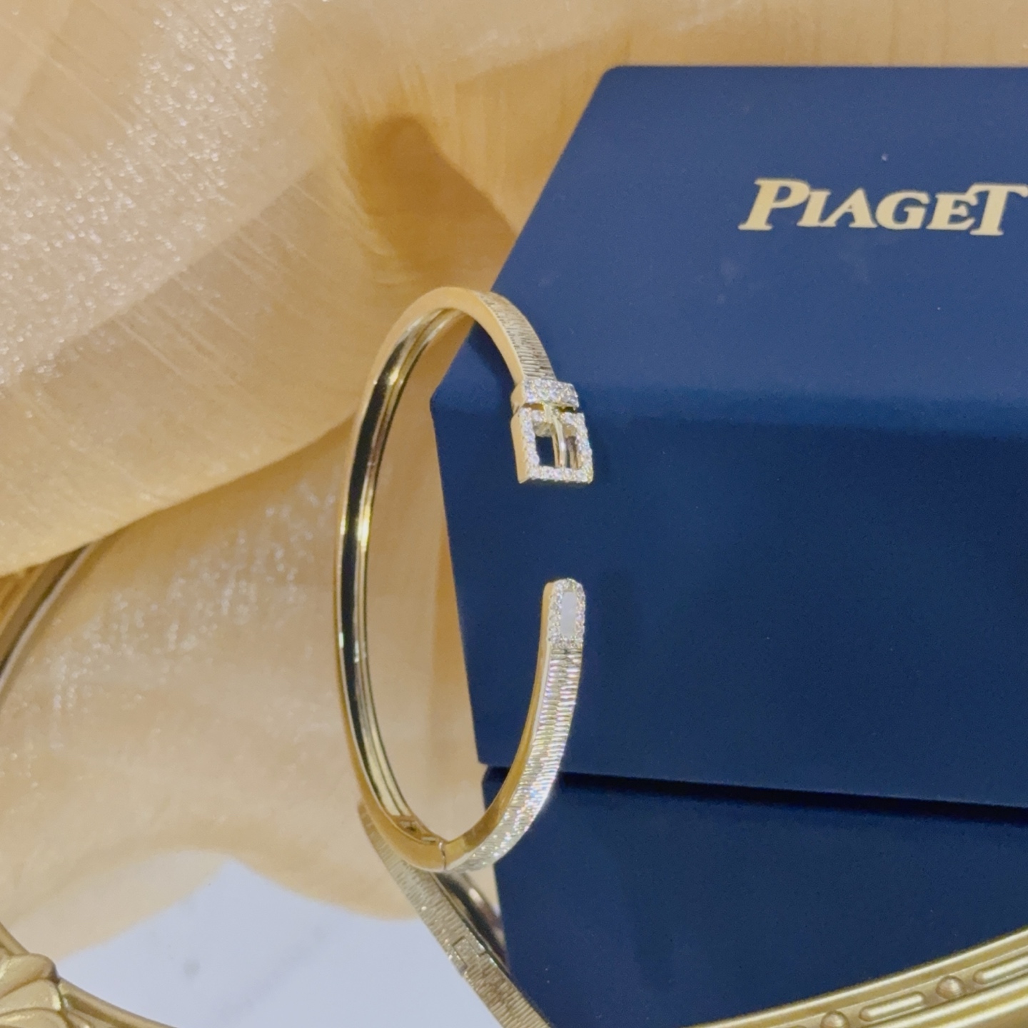 Piaget Possession Buckle Cuff bracelet 18k yellow gold with clear diamond accents and white mother-of-pearl inlay 17cm inner circumference