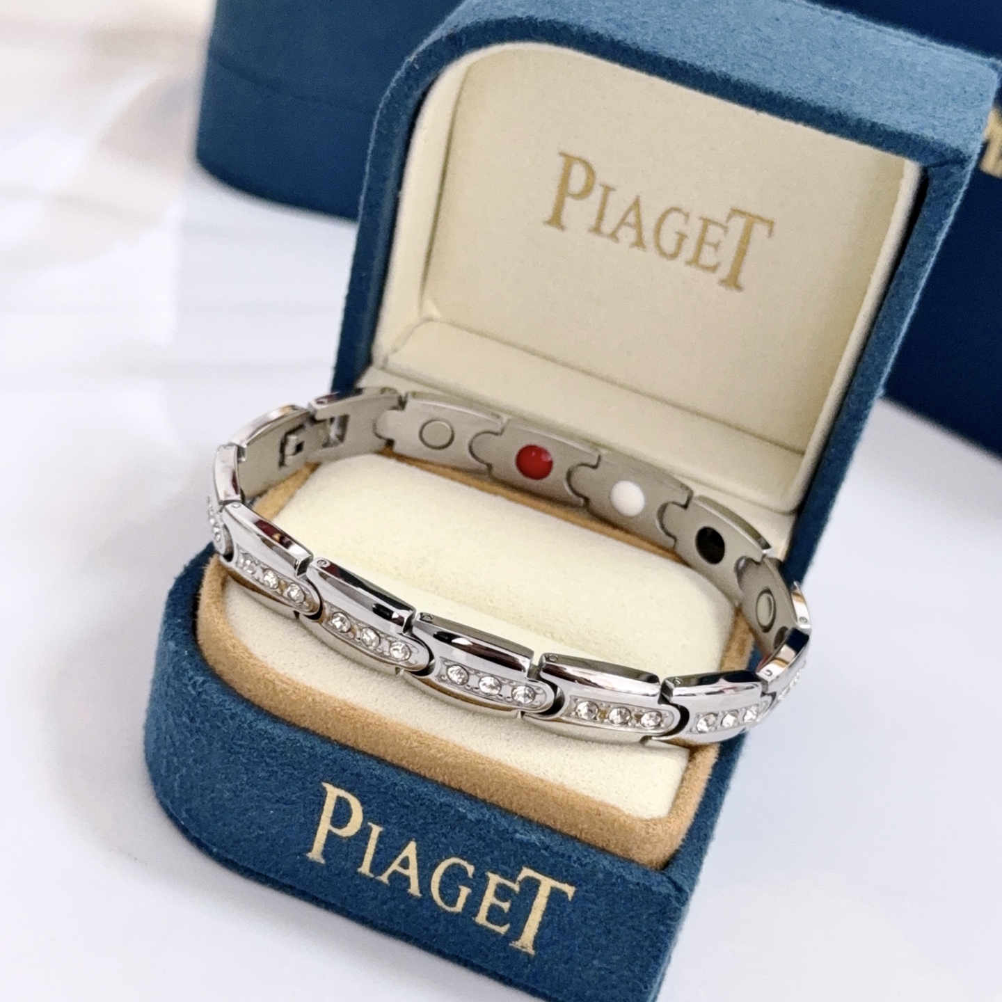 Piaget Au750 Diamond Link Bracelet bracelet Silver-toned 18k white gold with clear round diamonds inner links with black white red accent elements 19cm