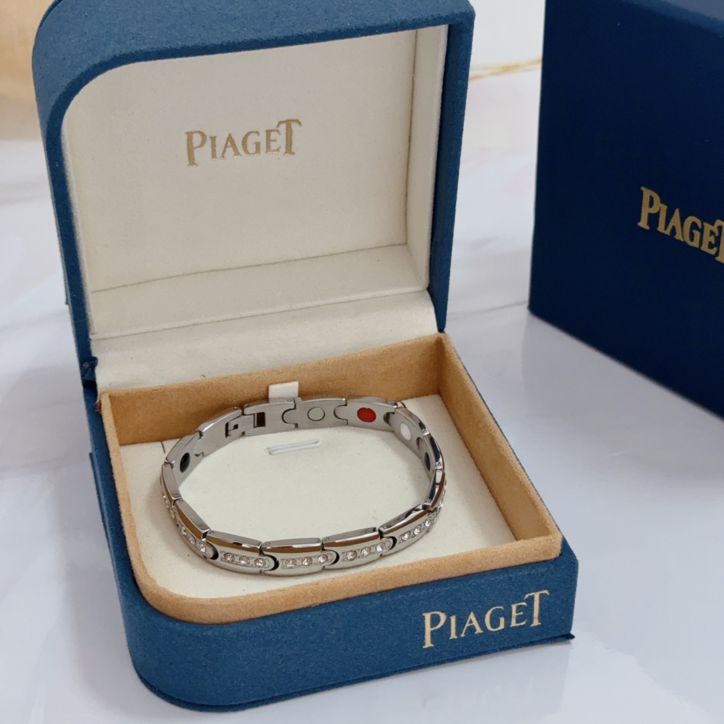 Piaget Au750 Diamond Link Bracelet bracelet Silver-toned 18k white gold with clear round diamonds inner links with black white red accent elements 19cm