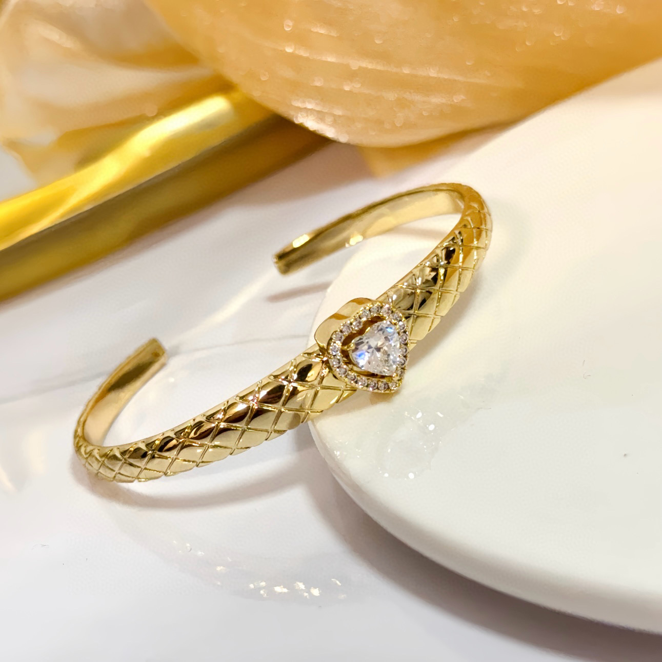 Piaget Heart Diamond Quilted Cuff bracelet 18k yellow gold with clear heart-cut diamond and clear diamond accents 17cm inner circumference